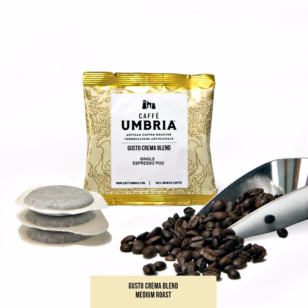 Three espresso pods, coffee beans and scoop, cream pod pouch.